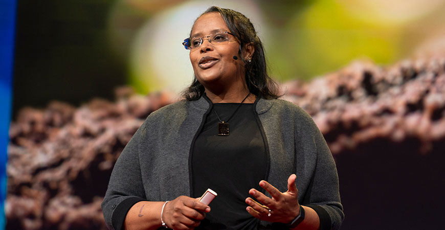 Professor Berhe on stage delivering a TEDTalk