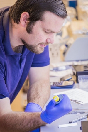 John Wilson using pipet