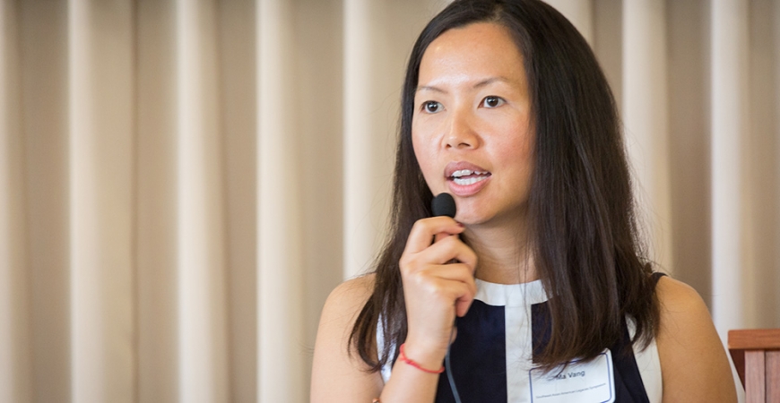 Ma Vang speaking with a small microphone