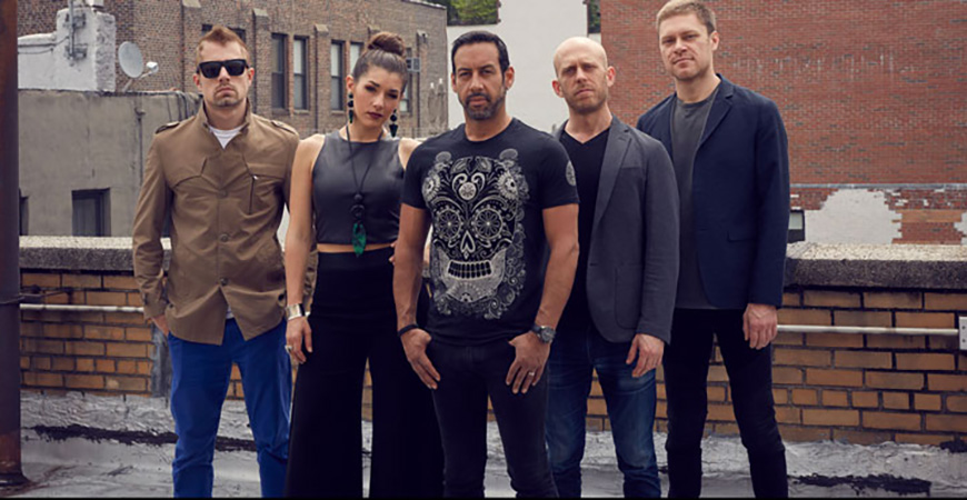 Antonio Sanchez posing outside with 5-piece band Migration