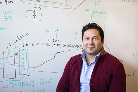 Professor Alexander Petersen in front of whiteboard