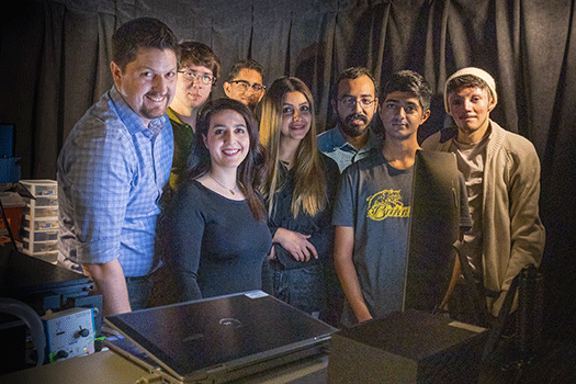Spencer with 7 students in UC lab