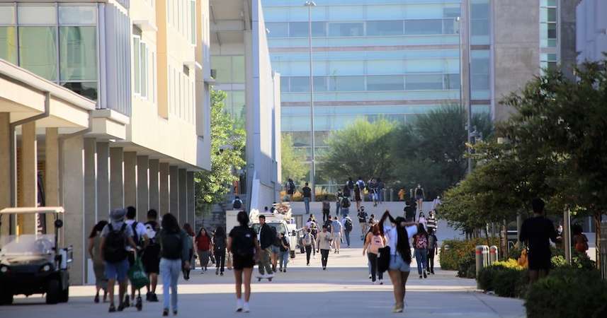Students stroll along Academic Walk at UC Merced. 