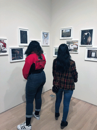 Two students view art gallery