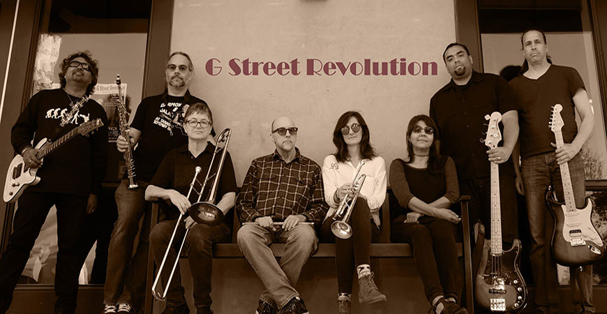 The 8-member band G Street Revolution holding their respective instruments