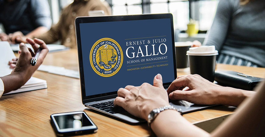 The Ernest & Julio Gallo School of Management Banner Logo displayed on a laptop