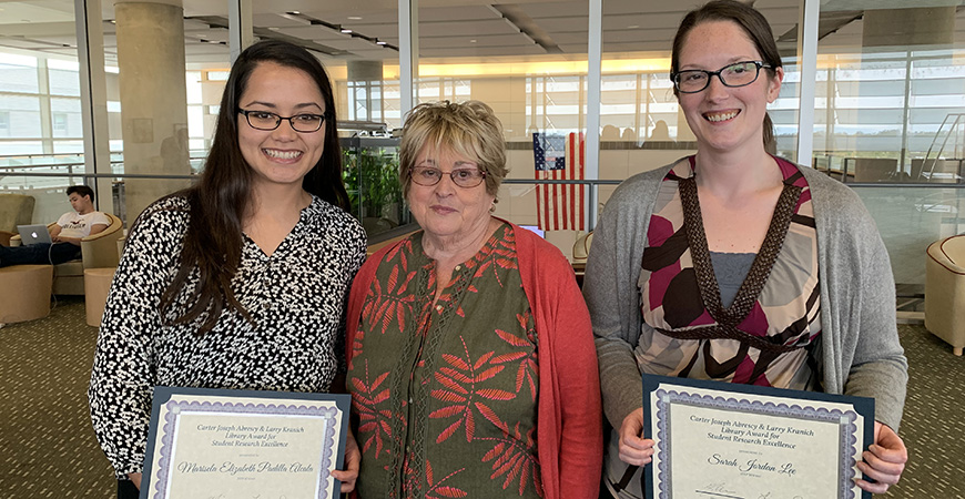 Marisela Padilla Alcala (left) and Sarah Lee were recently recognized as recipients of the Carter Joseph Abrescy and Larry Kranich Library Award for Student Research Excellence. Arlene Kranich (center) presented the awards.