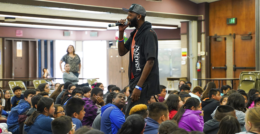 Devon Glover, The Sonnet Man, speaks to students at Gracey Elementary School in Merced.