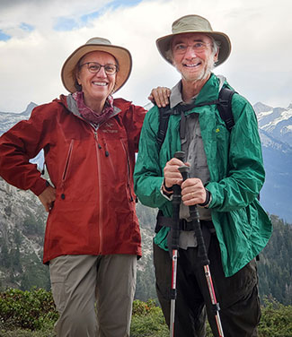 Martha Conklin and Roger Bales hiking in the mountains