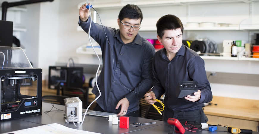 Two students in an engineering lab